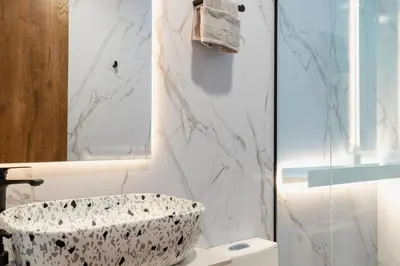 a bathroom with a marble sink and a shower at Ll 203 4BR 4Bath Apartment close to lleras park - Poblado - Medellín in Medellín