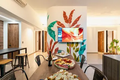 a dining room with a table with food on it at Ll 203 4BR 4Bath Apartment close to lleras park - Poblado - Medellín in Medellín