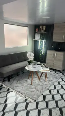 a living room with a couch and a table at Apartamento en Itagüí in Itagüí