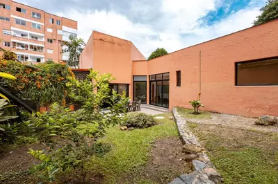 an exterior view of a brick building at 5BR Poblado Villa close to Lleras Jacuzzi Cinema AC in Medellín