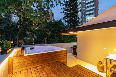 a hot tub on the deck of a building at B3 4BR Poblado Penthouse wit AC and Jacuzzi in Medellín