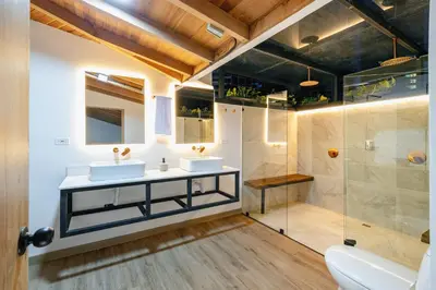 a bathroom with two sinks and a shower at B3 4BR Poblado Penthouse wit AC and Jacuzzi in Medellín