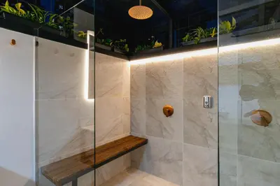 a bathroom with a shower with a glass door at B3 4BR Poblado Penthouse wit AC and Jacuzzi in Medellín