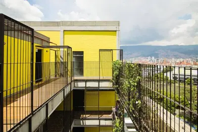 a yellow building on top of a building at Modern Loft in Laureles in Medellín