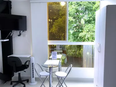 a room with a table and chairs and a window at Mini Loft in Envigado in Envigado