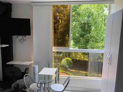 a window in a room with a table and chairs at Mini Loft in Envigado in Envigado