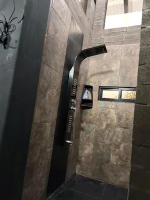 a hallway in a building with a stone wall at Espectacular Cabaña en Rionegro Antioquia, vista paisajes in Rionegro