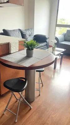 a living room with a table and a couch at Aparta estudio muy bien ubicado in Medellín