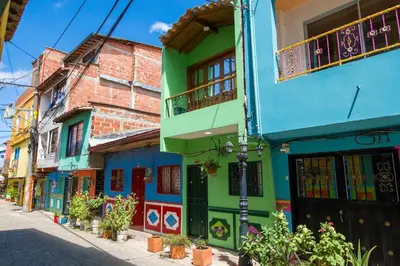 a group of colorful buildings on a street at Beautiful Modern House in Guatape! in Guatapé