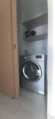 a washer and dryer in a room at Your Laureles home away from home, great rates! in Medellín