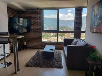 a living room with a couch and a table at Penthouse Rooftop terrace Gem in the sky-Laureles in Medellín