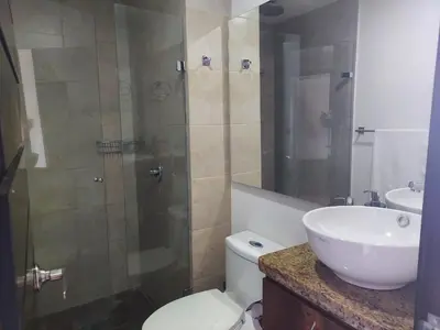 a bathroom with a shower and a toilet and a sink at Penthouse Rooftop terrace Gem in the sky-Laureles in Medellín