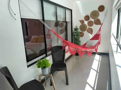 a hammock in a room with a bedroom at Apartamento con balcón y hamaca en zona rosa laureles 301 in Medellín