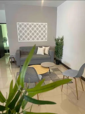 a living room with a couch and a table and chairs at Apartamento con balcón y hamaca en zona rosa laureles 301 in Medellín
