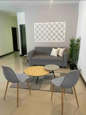 a living room with a couch and a table and chairs at Apartamento con balcón y hamaca en zona rosa laureles 301 in Medellín