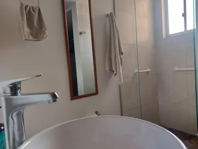 a bathroom with a sink and a shower at Lovely one bedroom condo in beautiful Laureles in Medellín