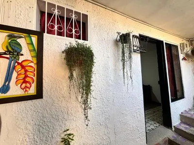 a building with a painting of a bird on the wall at Aparta estudio comuna trece in Medellín