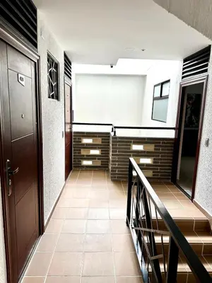 a hallway with a staircase in a building at Espectacular apartamento en Itagui in Itagüí
