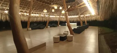 a room with chairs and tables in a building at Finca Dubai in San Jerónimo