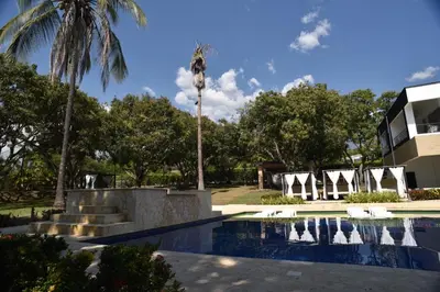 a resort with a swimming pool and palm trees at Finca Dubai in San Jerónimo