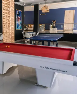 a pool table in a room with two ping pong tables at Finca Dubai in San Jerónimo