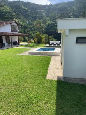 a yard with a pool and a house at FINCA LA MIEL en Barbosa Antioquia in Barbosa
