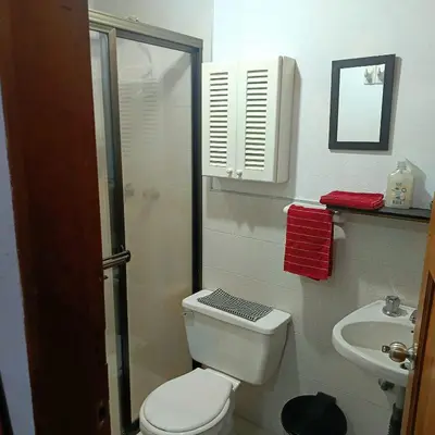 a bathroom with a toilet and a shower and a sink at HOSTAL - COLIVING - Cerca MetroCable ARVI in Guarne