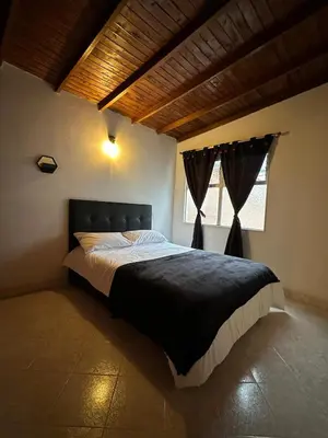 a bedroom with a large bed in a room at Apto con vista en distrito cultural de Medellín in Medellín