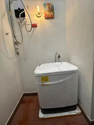 a toilet in a bathroom with a shower at Apto con vista en distrito cultural de Medellín in Medellín