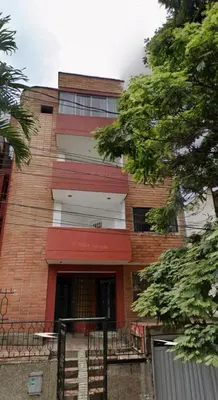 a red brick building with a staircase in front of it at Apto con vista en distrito cultural de Medellín in Medellín