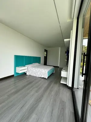 a bedroom with a bed in the middle of it at Casa en Rionegro, a pocos minutos del aeropuerto in Rionegro