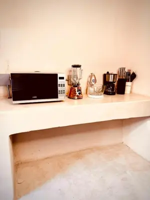a counter with a microwave and other appliances on it at The best of Envigado, close to everything in Envigado