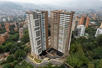 an aerial view of two tall buildings in a city at Grand By Jalo in Medellín