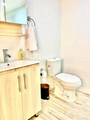 a bathroom with a toilet and a sink at Digital nomads, everything close Ac Wi-fi fast in Medellín