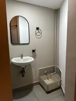 a bathroom with a sink and a mirror at Apartamento parque poblado lleras jacuzzi aire provenza in Medellín