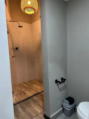 a bathroom with a shower and a toilet at Apartamento parque poblado lleras jacuzzi aire provenza in Medellín