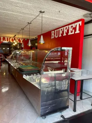 a buffet in a fast food restaurant with a sign at Hotel boutique san pablo H4 in Medellín
