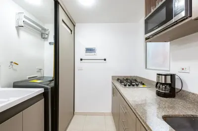 a kitchen with a counter top and a sink at Mirador Verde by MOME in Medellín