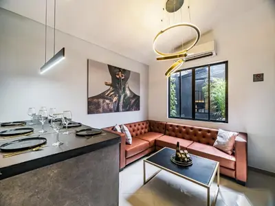 a living room with a couch and a table at One Apartments Lleras in Medellín