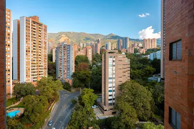 an aerial view of a city with tall buildings at Magnífico apartamento de 2 habitaciones con AC y vistas en Provenza in Medellín