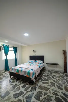 a bedroom with a bed in a room at Belén Vibe in Medellín