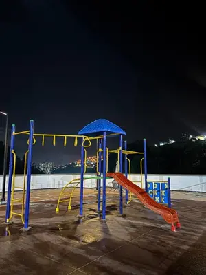 a playground in a parking lot at night at Acogedor y moderno apartamento en Manizales in Manizales