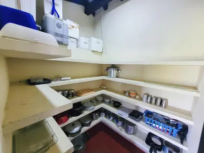 a small kitchen with a sink and some shelves at Finca Doña Ana in Palestina