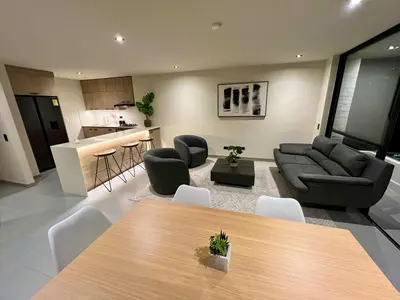 a living room with a couch and a table at Designed 3-Bedroom Apartment & Office with 800 Wi-Fi, New Samsung Appliances in Envigado