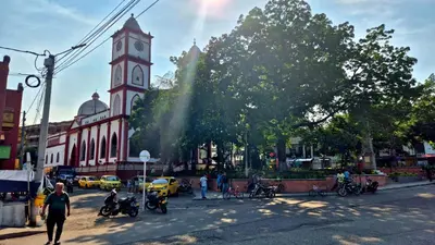 a large building with a clock tower in a city at Mirador del Río in Honda