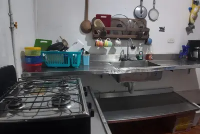 a kitchen counter with a sink and a stove at Mirador del Río in Honda