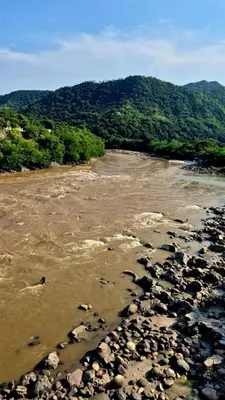 a river with lots of rocks in the water at Mirador del Río in Honda