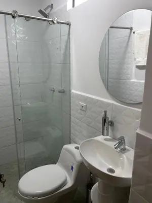 a bathroom with a shower and a toilet and a sink at Casa Selva in San Carlos