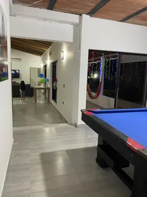 a room with a pool table in a room at Villa Paulina in Ebéjico