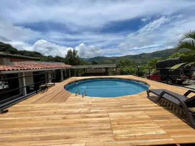a swimming pool on the deck of a house at Villa Paulina in Ebéjico